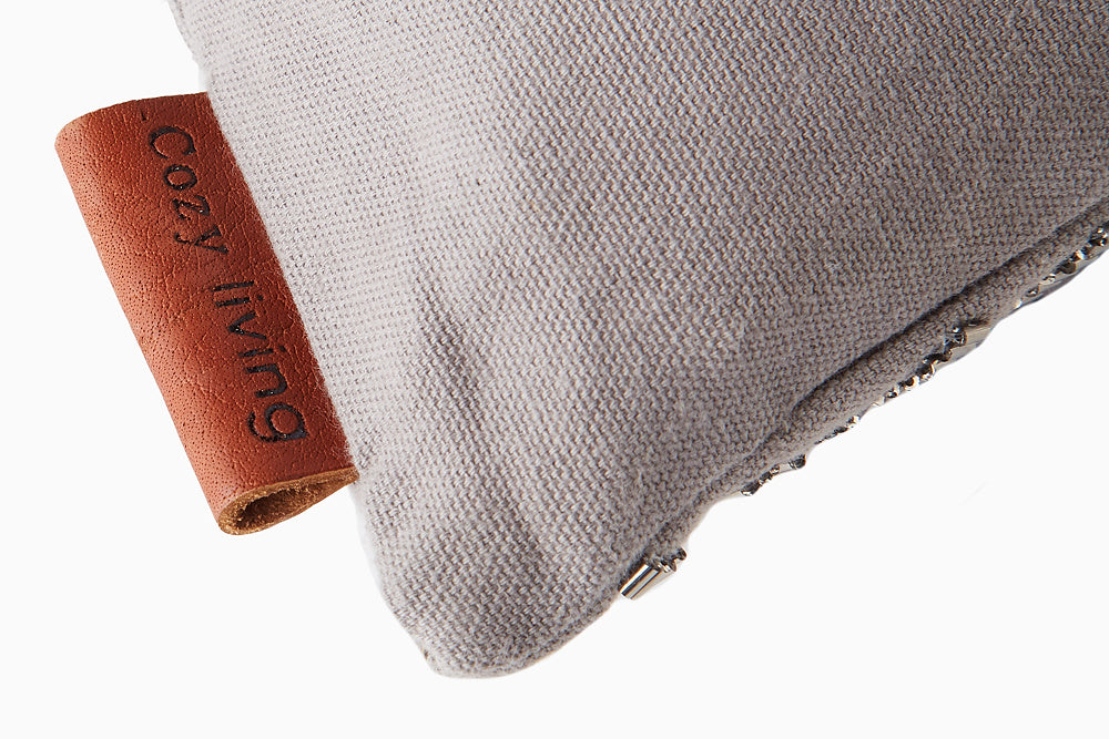 grey embroidered cushion
