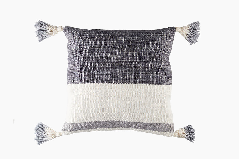 grey and white tassel cushion