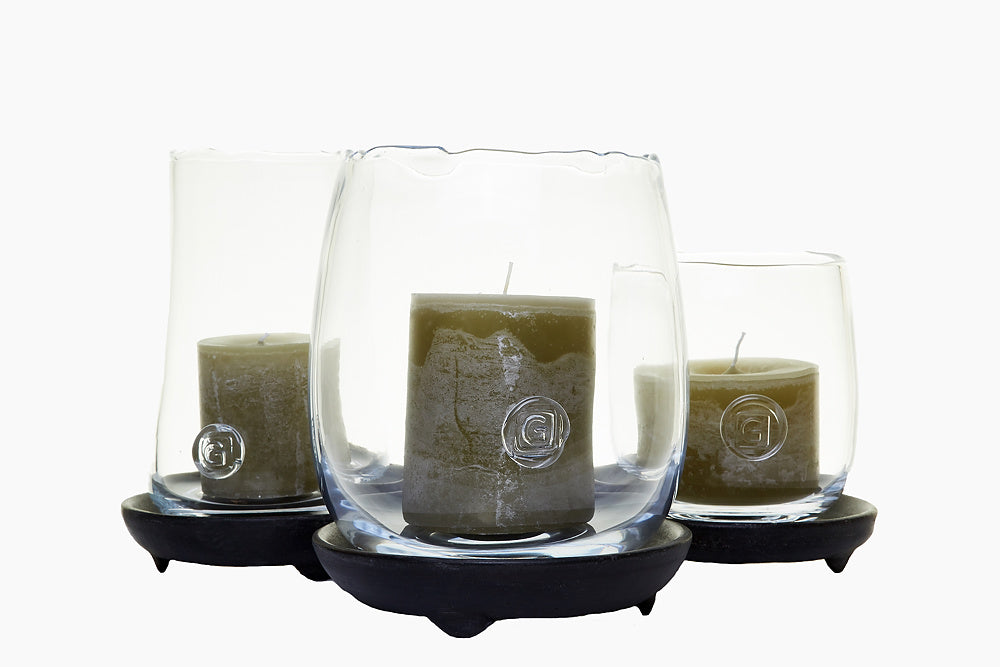 Olive candles in glass hurricane