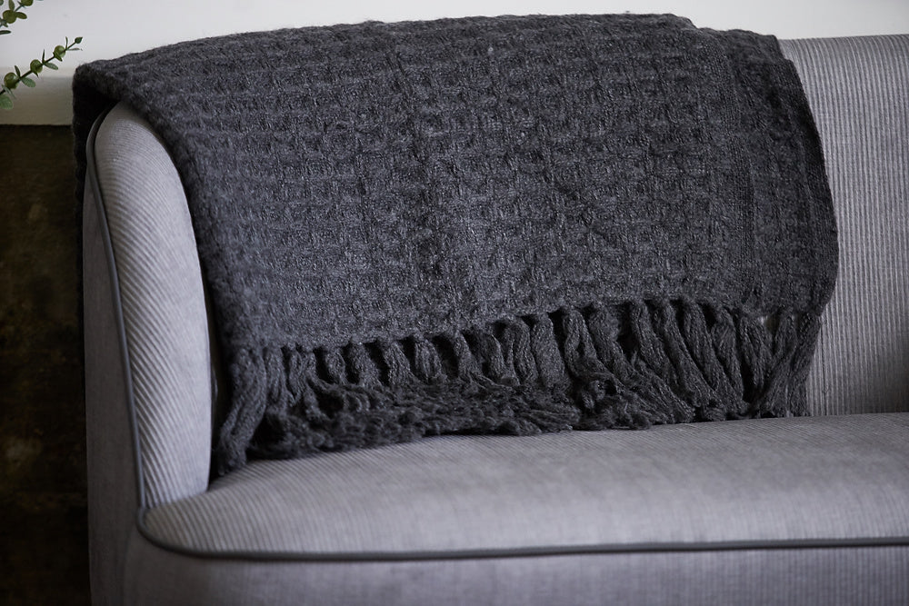 dark grey throw on sofa