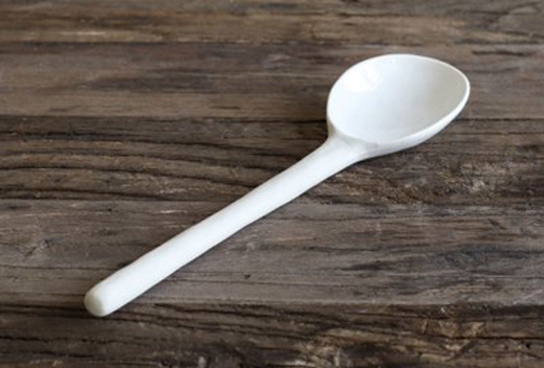 white porcelain serving spoon